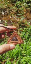Load and play video in Gallery viewer, Astrophyllite Triangular Frame Copper Wire Wrapped Pendant
