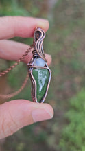 Load and play video in Gallery viewer, Green Jadeite Gemstone with a Round Moonstone Pendant Wrapped in Copper
