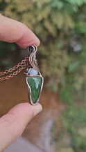 Load and play video in Gallery viewer, Green Jadeite Gemstone with a Round Moonstone Pendant Wrapped in Copper
