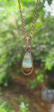 Load and play video in Gallery viewer, Lemurian Aquatine Calcite Dew Drop Cabochon Wire Wrapped Pendant
