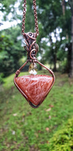 Load image into Gallery viewer, Curved Triangular Shape Orange Confetti Sunstone Gemstone with a Dangling Swarovski Crystal Bead Wrapped in Pure Copper Wire Pendant/Necklace
