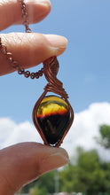 Load image into Gallery viewer, Natural Warm Yellow and Smoky Brown Coloured Baltic Amber Pear-shaped Cabochon Wire Wrapped Pendant
