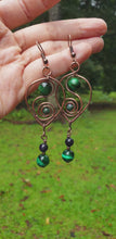 Load and play video in Gallery viewer, Dangling Green Tiger Eye Earrings in Hearts and Swirls
