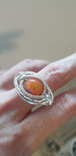 Load and play video in Gallery viewer, Orange Mexican Fire Opal set in Sterling Silver Wire Wrap Ring
